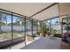 Relaxing screened porch with patio furniture and potted plants at 1119 76Th Nw St, Bradenton, FL 34209