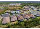 Aerial view of a house with a pool in a residential neighborhood at 116 Daylily Blvd, Nokomis, FL 34275