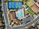 Aerial view of community amenities including pool, pickleball courts, bocce ball, and clubhouse at 116 Daylily Blvd, Nokomis, FL 34275