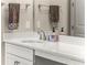 Bright bathroom boasts double vanity with quartz countertop at 116 Daylily Blvd, Nokomis, FL 34275