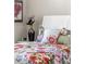 Charming bedroom with floral bedding and decor at 116 Daylily Blvd, Nokomis, FL 34275