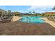 Relax and enjoy the resort-style community pool with lounge chairs at 116 Daylily Blvd, Nokomis, FL 34275