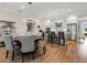 Open concept dining area with modern table and chairs, adjacent to kitchen at 116 Daylily Blvd, Nokomis, FL 34275