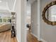 Bright hallway with decorative shelving and a view to bedroom at 116 Daylily Blvd, Nokomis, FL 34275