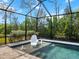 Screened pool area with unique chair and fountains at 116 Daylily Blvd, Nokomis, FL 34275