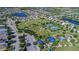 Aerial view of community featuring a park, lake, playground, tennis courts at 11924 Forest Park Cir, Bradenton, FL 34211