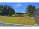 Peaceful backyard view of a pond and lush greenery at 11924 Forest Park Cir, Bradenton, FL 34211