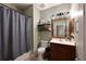 Clean bathroom with a tub, toilet, and updated vanity at 11924 Forest Park Cir, Bradenton, FL 34211