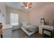 Cozy bedroom with a queen bed and light pink walls at 11924 Forest Park Cir, Bradenton, FL 34211