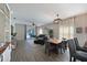 Bright and airy dining room with hardwood floors and a rustic farmhouse table at 11924 Forest Park Cir, Bradenton, FL 34211