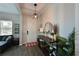 Bright and airy entryway with console table and mirror at 11924 Forest Park Cir, Lakewood Ranch, FL 34211