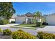 Tan one story house with a two car garage at 11924 Forest Park Cir, Lakewood Ranch, FL 34211