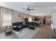 Open living room featuring a sectional sofa and wood-look floors at 11924 Forest Park Cir, Lakewood Ranch, FL 34211