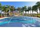 Community spray park with shaded seating and palm trees at 11924 Forest Park Cir, Bradenton, FL 34211