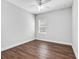 Simple bedroom with wood-look flooring and neutral walls at 12310 Halfmoon Lake Ter, Bradenton, FL 34211