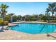 Inviting community pool with lounge chairs at 12310 Halfmoon Lake Ter, Bradenton, FL 34211