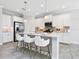 Modern kitchen with white cabinets, stainless steel appliances, and an island at 12310 Halfmoon Lake Ter, Bradenton, FL 34211