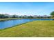 Community waterfront view with lush landscaping at 12310 Halfmoon Lake Ter, Bradenton, FL 34211