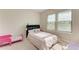 Cozy bedroom with a bed, window blinds, and soft lighting at 16446 Slate Pl, Bradenton, FL 34211