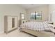 Light-filled bedroom featuring a queen bed and dresser at 16446 Slate Pl, Bradenton, FL 34211