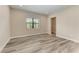 Bright bedroom with wood-look floors and window at 16446 Slate Pl, Bradenton, FL 34211