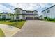 Two-story house with three-car garage and paver driveway at 16446 Slate Pl, Bradenton, FL 34211