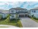 Two-story house with three-car garage and paver driveway at 16446 Slate Pl, Bradenton, FL 34211