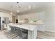 Modern kitchen with white cabinets, quartz island, and stainless steel appliances at 16446 Slate Pl, Bradenton, FL 34211