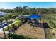 playground with swings, slides, and shade structure at 16446 Slate Pl, Bradenton, FL 34211