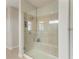 Large walk-in shower with glass enclosure and built-in seat at 16446 Slate Pl, Bradenton, FL 34211