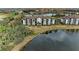 Aerial view showcases community building near water at 16706 Vardon Ter # 205, Bradenton, FL 34211