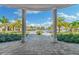 View of the community pool and clubhouse from a covered walkway at 16706 Vardon Ter # 205, Bradenton, FL 34211