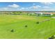 Expansive driving range with many golfers practicing at 16706 Vardon Ter # 205, Bradenton, FL 34211