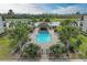 Community pool with a gazebo and plenty of lounge chairs at 16706 Vardon Ter # 205, Bradenton, FL 34211