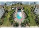 Resort-style community pool area with gazebo and lush landscaping at 16706 Vardon Ter # 205, Bradenton, FL 34211