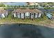 Condo building situated on a tranquil lake with parking and pool at 16904 Vardon Ter # 405, Bradenton, FL 34211