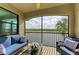 Spacious screened balcony with outdoor seating and scenic views at 16904 Vardon Ter # 405, Bradenton, FL 34211