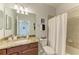 Well-appointed bathroom with granite countertop and shower/tub combo at 16904 Vardon Ter # 405, Bradenton, FL 34211