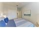 Guest bedroom with a comfortable bed and plenty of closet space at 16904 Vardon Ter # 405, Bradenton, FL 34211