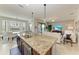 Gourmet kitchen with granite island and stainless steel appliances at 16904 Vardon Ter # 405, Bradenton, FL 34211