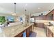 Modern kitchen with granite countertops and wood cabinets at 16904 Vardon Ter # 405, Bradenton, FL 34211