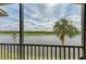 Peaceful water view from the balcony, featuring lush greenery at 16904 Vardon Ter # 405, Bradenton, FL 34211