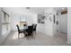 Dining area with glass-top table and black chairs at 1944 Vista Landings Ct, Port Charlotte, FL 33953