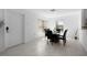 Bright dining room featuring a glass table with black leather chairs at 1944 Vista Landings Ct, Port Charlotte, FL 33953