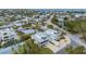 Aerial view showcasing a two-story home's location in a residential area near the water at 220 82Nd St, Holmes Beach, FL 34217