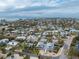 Aerial view of a house with a large yard, close to the water at 220 82Nd St, Holmes Beach, FL 34217