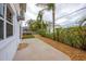 Small, well-maintained backyard with patio and privacy at 220 82Nd St, Holmes Beach, FL 34217