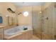 Spa-like bathroom with corner tub and walk-in shower at 220 82Nd St, Holmes Beach, FL 34217