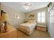 Cozy bedroom featuring a queen-size bed and calming coastal decor at 220 82Nd St, Holmes Beach, FL 34217