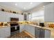 Modern kitchen with stainless steel appliances and white cabinets at 220 82Nd St, Holmes Beach, FL 34217